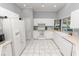 Kitchen with white cabinets, tile floors and stainless steel appliances at 1520 Royal Forest Loop, Lakeland, FL 33811