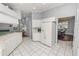 Kitchen boasts white cabinets, stainless steel appliances, and an island at 1520 Royal Forest Loop, Lakeland, FL 33811