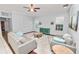 Living room with comfortable seating, wood floors, and large windows at 1520 Royal Forest Loop, Lakeland, FL 33811