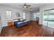 Main bedroom with hardwood floors, a ceiling fan, and pool view at 1520 Royal Forest Loop, Lakeland, FL 33811