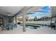 Inviting pool area with screened enclosure, patio furniture, and a built-in grill at 1520 Royal Forest Loop, Lakeland, FL 33811