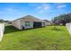 Large backyard with lush lawn and privacy fence at 1655 Laurel Oaks Dr, Bartow, FL 33830