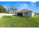 Spacious backyard with a screened patio and lush lawn at 1655 Laurel Oaks Dr, Bartow, FL 33830