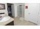 Bathroom with double vanity, shower, and walk-in closet at 1655 Laurel Oaks Dr, Bartow, FL 33830