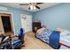 Light and airy bedroom featuring wood-look floors and a ceiling fan at 1655 Laurel Oaks Dr, Bartow, FL 33830