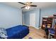 Serene bedroom with a full-size bed, ample closet space, and a ceiling fan at 1655 Laurel Oaks Dr, Bartow, FL 33830