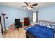 Cozy bedroom with a queen-size bed, a desk, and ceiling fan at 1655 Laurel Oaks Dr, Bartow, FL 33830