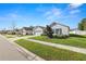 Enticing street view of a charming house with a lush lawn and two-car garage at 1655 Laurel Oaks Dr, Bartow, FL 33830