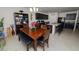 Open kitchen with dark cabinets, island, and breakfast nook at 1655 Laurel Oaks Dr, Bartow, FL 33830