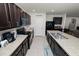 Open kitchen with island, dark cabinets, and breakfast bar seating at 1655 Laurel Oaks Dr, Bartow, FL 33830