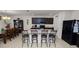 Open kitchen with island, dark cabinets, and breakfast bar seating at 1655 Laurel Oaks Dr, Bartow, FL 33830