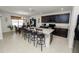 Modern kitchen with dark cabinetry, granite counters, and island with seating at 1655 Laurel Oaks Dr, Bartow, FL 33830