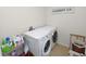 Bright laundry room with washer, dryer, and laundry storage at 1655 Laurel Oaks Dr, Bartow, FL 33830