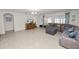 Open concept living room with a comfortable sectional sofa and tile floors at 1655 Laurel Oaks Dr, Bartow, FL 33830