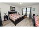 Spacious main bedroom with a king-size bed and plenty of natural light at 1655 Laurel Oaks Dr, Bartow, FL 33830