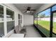 Relaxing screened porch with ceiling fan and outdoor seating at 1655 Laurel Oaks Dr, Bartow, FL 33830
