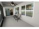 Peaceful screened-in porch with seating area and backyard views at 1655 Laurel Oaks Dr, Bartow, FL 33830