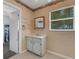 Small bathroom with vanity, sink, and window at 1704 Pineberry Ct, Lakeland, FL 33803