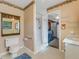 Bathroom with shower, toilet, sink, and laundry hookups at 1704 Pineberry Ct, Lakeland, FL 33803