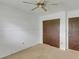 Spacious bedroom with double doors and ceiling fan at 1704 Pineberry Ct, Lakeland, FL 33803