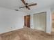 Well-lit bedroom with double door closet and ceiling fan at 1704 Pineberry Ct, Lakeland, FL 33803