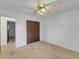Bright bedroom with ceiling fan and double closets at 1704 Pineberry Ct, Lakeland, FL 33803