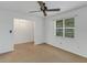 Bedroom with carpet, ceiling fan and window with blinds at 1704 Pineberry Ct, Lakeland, FL 33803