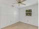 Bedroom featuring ceiling fan and wood paneling at 1704 Pineberry Ct, Lakeland, FL 33803