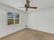 Bright bedroom with carpet, ceiling fan and window at 1704 Pineberry Ct, Lakeland, FL 33803