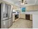 Kitchen features stainless steel appliances and light beige cabinets at 1704 Pineberry Ct, Lakeland, FL 33803