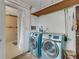 Laundry room with washer, dryer, and access to bathroom at 1704 Pineberry Ct, Lakeland, FL 33803
