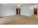 Spacious living room with neutral carpeting and ceiling fan at 1704 Pineberry Ct, Lakeland, FL 33803
