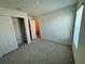 Spacious bedroom with carpet and closet at 2300 Crossandra St, Mascotte, FL 34753