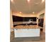 Kitchen with dark cabinets and island at 2300 Crossandra St, Mascotte, FL 34753