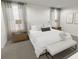 Main bedroom with two night stands and bench at the foot of the bed at 2327 Northumberland Ct, Haines City, FL 33844