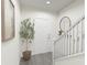 Bright entryway with staircase, mirror, and potted plant at 2327 Northumberland Ct, Haines City, FL 33844