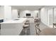Open concept kitchen with island and adjacent living area at 2327 Northumberland Ct, Haines City, FL 33844