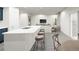 Open concept kitchen with island and adjacent living area at 2327 Northumberland Ct, Haines City, FL 33844