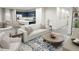 Living room with a sofa, coffee table, and adjacent kitchen at 2327 Northumberland Ct, Haines City, FL 33844