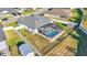 Aerial view of house, pool, and fenced backyard at 241 Walkers Point Dr, Auburndale, FL 33823
