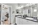 Double vanity bathroom with soaking tub and access to bedroom at 241 Walkers Point Dr, Auburndale, FL 33823