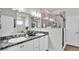 Double vanity bathroom with a large walk-in shower at 241 Walkers Point Dr, Auburndale, FL 33823