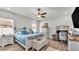 Spacious bedroom with a king-size bed and built-in work station at 241 Walkers Point Dr, Auburndale, FL 33823