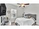 Cozy bedroom with a queen bed and TV at 241 Walkers Point Dr, Auburndale, FL 33823