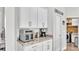 White kitchen cabinets, stainless steel appliances and ample counter space at 241 Walkers Point Dr, Auburndale, FL 33823