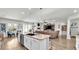 Open kitchen features a large island with seating and stainless steel appliances at 241 Walkers Point Dr, Auburndale, FL 33823