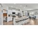 Modern kitchen with white cabinetry, stainless steel appliances, and an island at 241 Walkers Point Dr, Auburndale, FL 33823