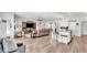 Open concept kitchen with island, stainless steel appliances, and white cabinets at 241 Walkers Point Dr, Auburndale, FL 33823