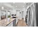 Modern kitchen with stainless steel appliances and white cabinets at 241 Walkers Point Dr, Auburndale, FL 33823