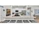 Bright kitchen with white cabinets, stainless steel appliances and large island at 241 Walkers Point Dr, Auburndale, FL 33823